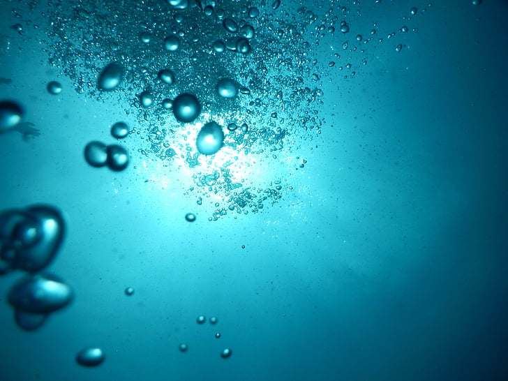 underwater photo of bubbles