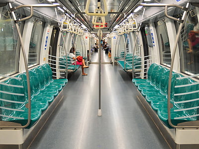woman sitting inside train