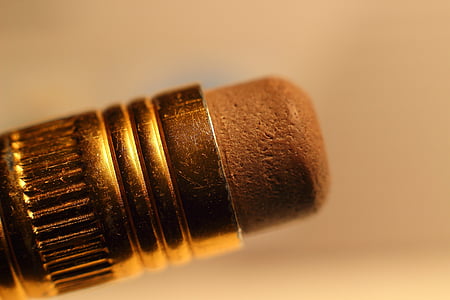 closeup photo of pen's brown eraser