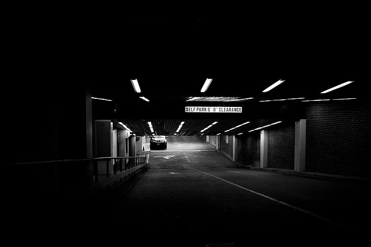 grascale photo of a parking basement