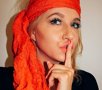 woman wearing orange headscarf