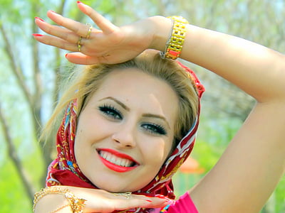 smiling woman wearing red and white hijab