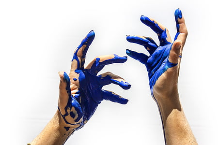 hands with blue paint