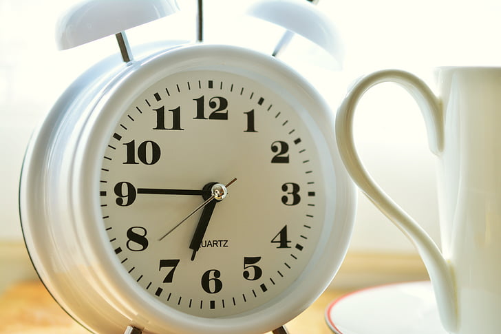 white bell alarm clock