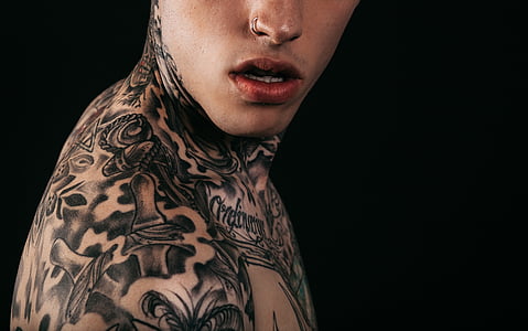photography of man with tattoos