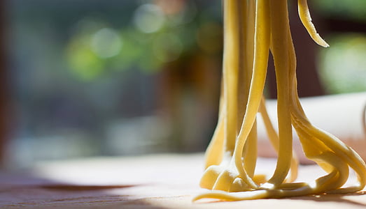shallow focus photography of yellow pasta