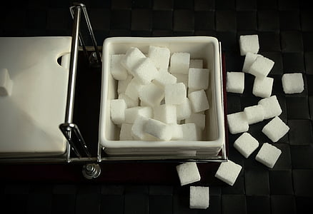 sugar cubes lot on white ceramic bowl