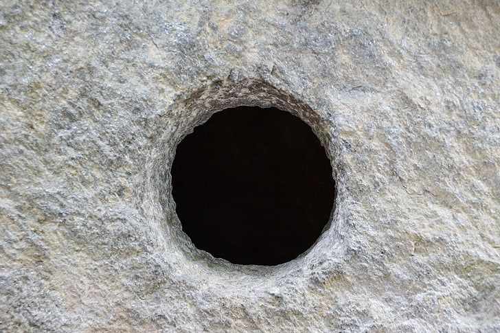gray concrete surface with hole