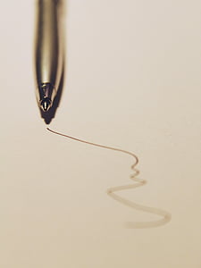 macro photography of silver ballpoint pen