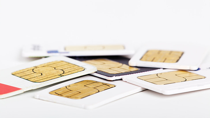 assorted sim cards on white surface