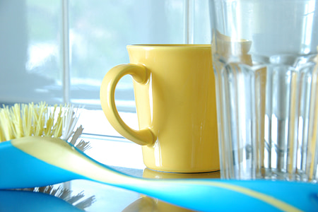yellow mug and clear glass cup