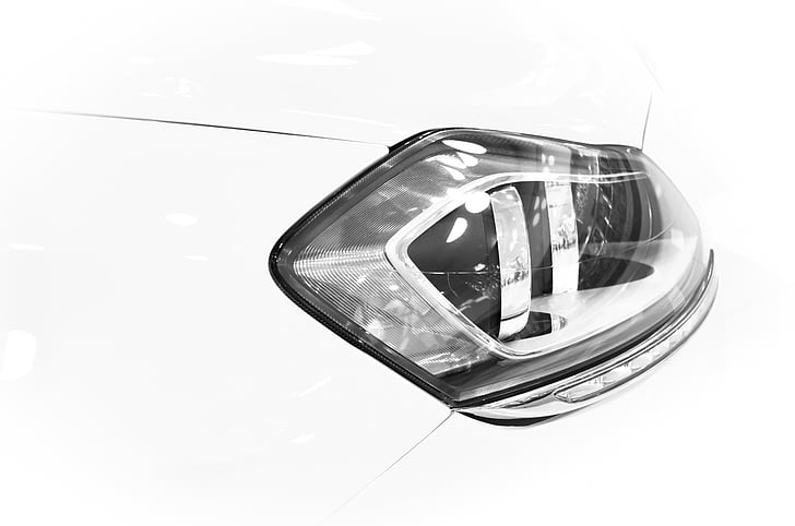 closeup photography of vehicle headlight