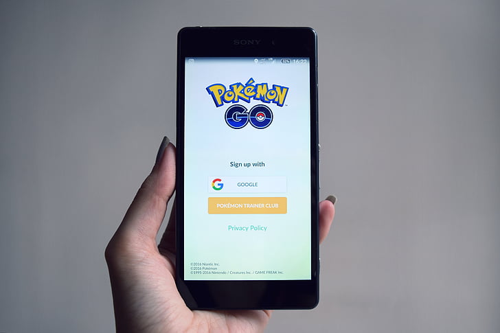 Royalty-Free photo: Person holds smartphone with Pokemon Go application running - PickPik