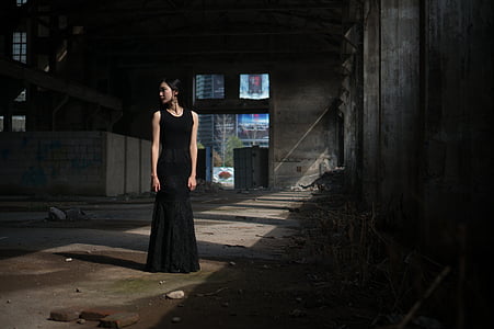 woman in black sleeveless gown