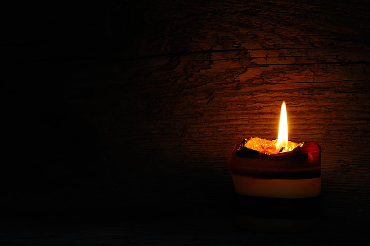 low-light photography of candle