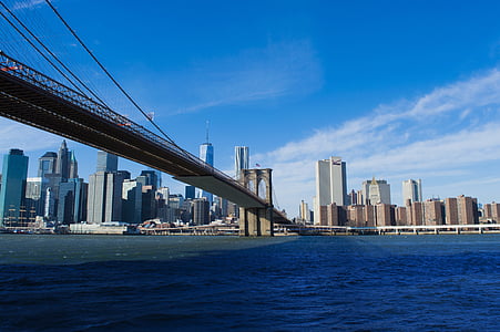 Freedom tower through Brooklyn bridge photo