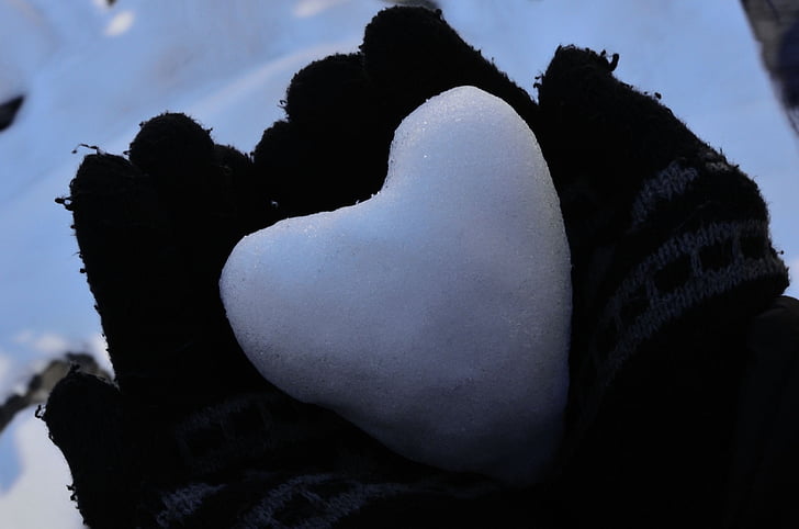 heart snow on person's palms