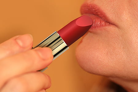 woman applying lip stick