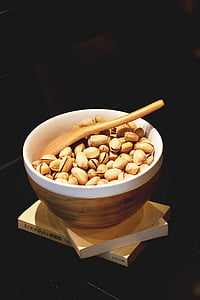 brown nut and white and brown bowl