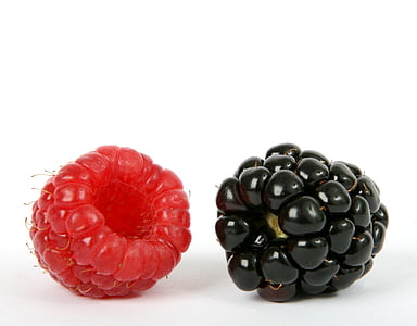 two berry fruits on white surface