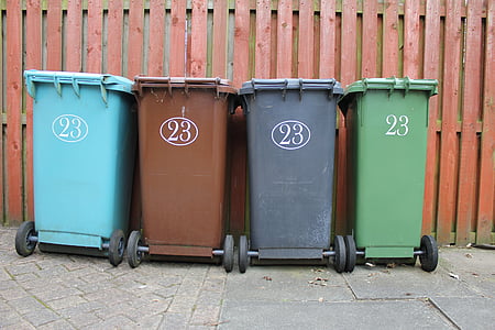 four assorted-color garbage cans