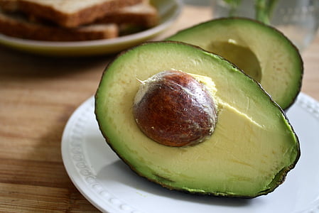sliced avocado on white plate