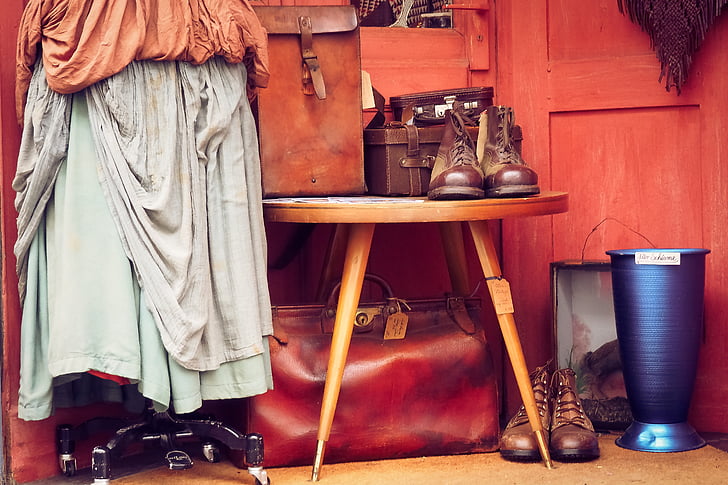pair of brown leather boots on brown wooden table