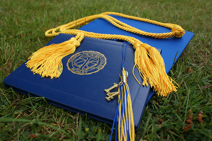 blue graduation book and hatg