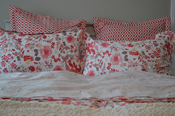 white, red, and gray floral bedding set