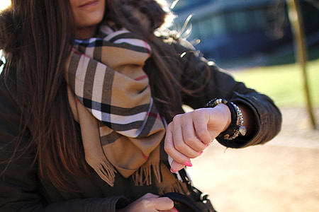 woman with brown plaid scarf