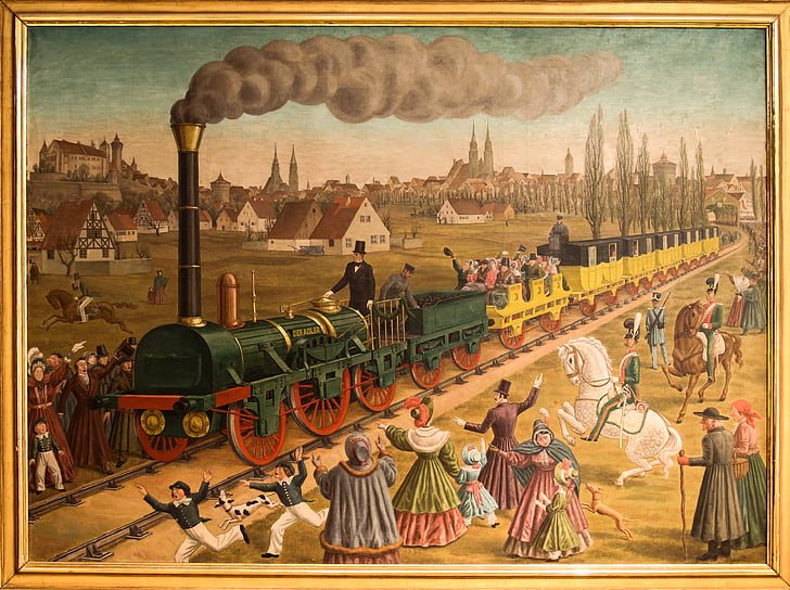 painting of train and people with beige wooden frame