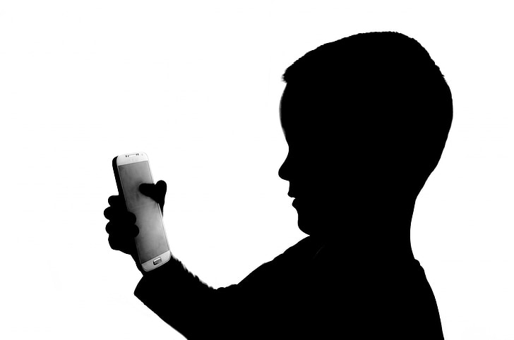 boy holding smartphone