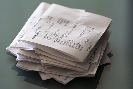 business receipt lot fold on gray surface