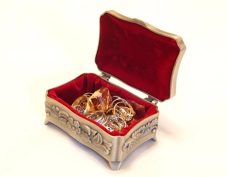 gold-colored rings in steel jewelry box
