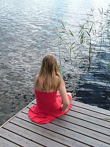 woman seat near water