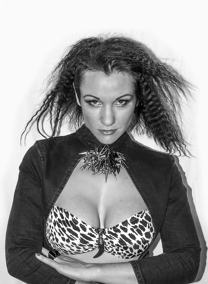 grayscale photography of woman in leopard print brassiere