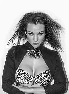 grayscale photography of woman in leopard print brassiere