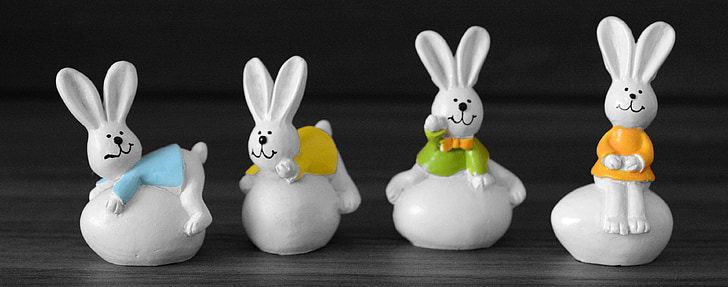 four rabbits figurines