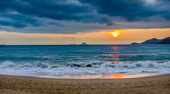 panoramic photography of shore under sunrise