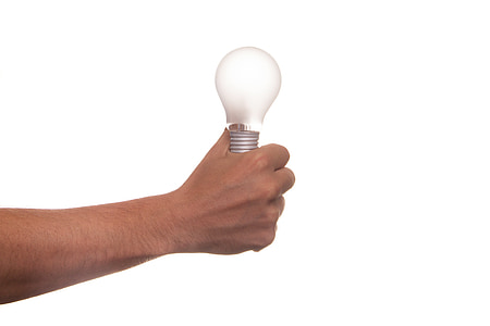 person holding light bulb