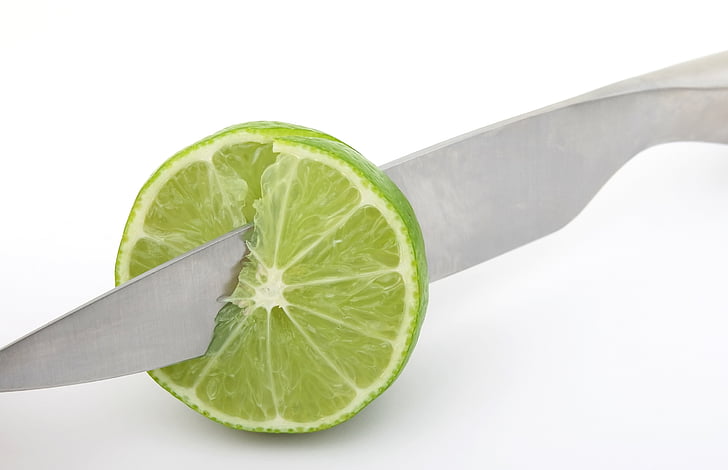sliced lime with gray knife