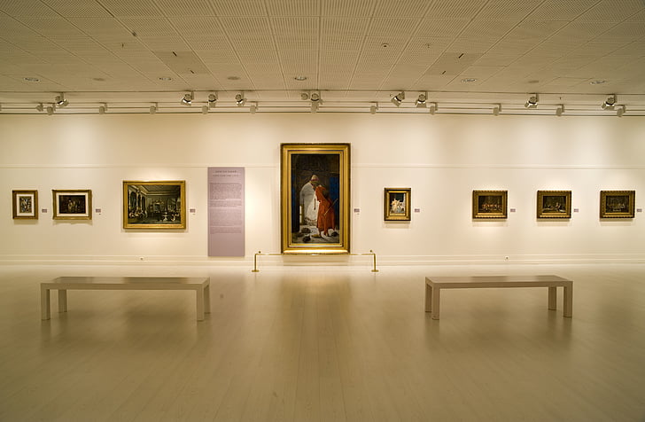 assorted-painting displayed in white room