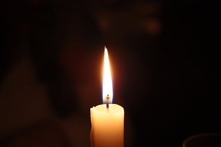 lighted taper candle