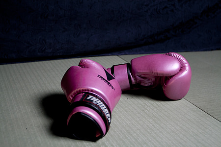 pair of pink and black boxing gloves