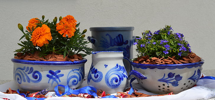 white-and-blue floral ceramic vase and bowls