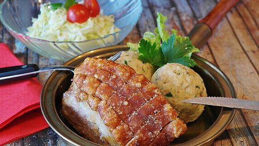 crispy pork skin and mashed potato served on stainless steel bowl