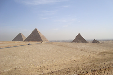three pyramids in the middle of desert