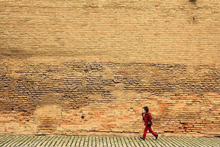 boy running near wall