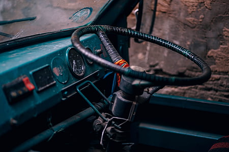 closeup photo of black vehicle steering wheel