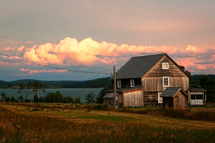 photo of wooden house during sunset